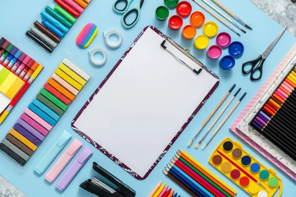 Colorful School Supplies Placed Blue Background White Plain Paper Middle — 图库照片