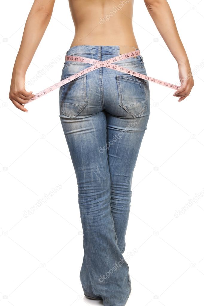 Woman measuring her wais