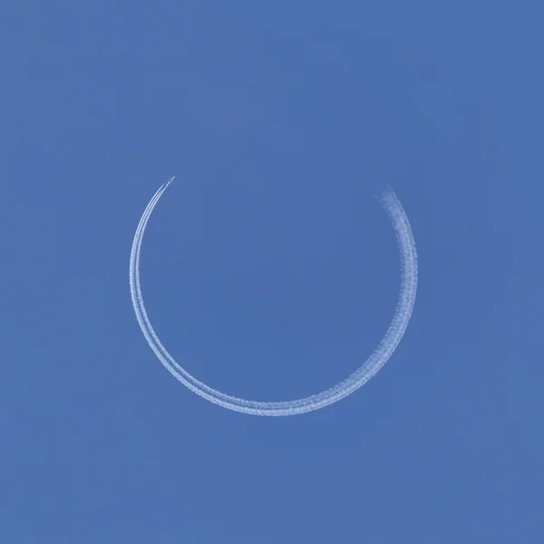 Airplane making circle trace — Stock Photo, Image