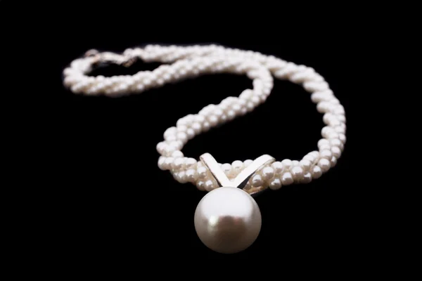 Pearl necklace isolated over dark background — Stock Photo, Image
