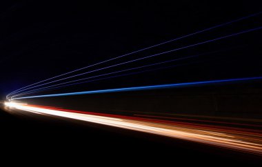 Car light trails in the tunnel. clipart