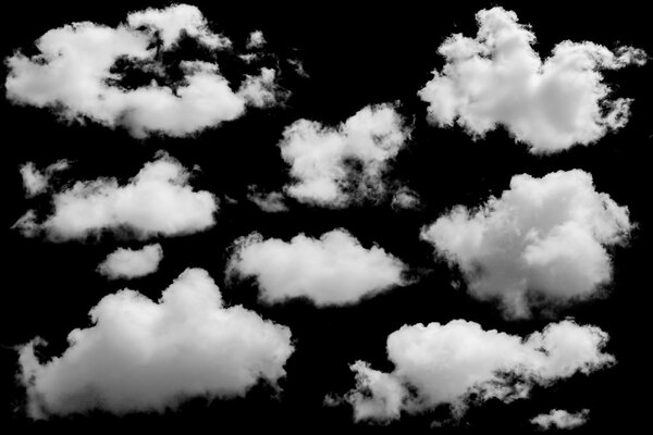 Set of isolated clouds over black.