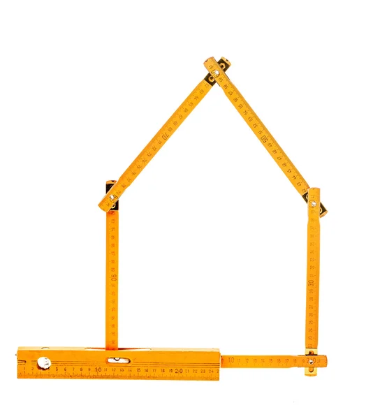 Oude gele houten meter en niveau — Stockfoto