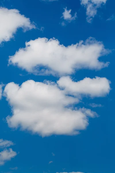 Set of white clouds over blue — Stock Photo, Image