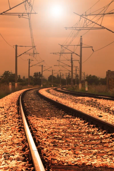 Curved railroad in sunset — Stock Photo, Image