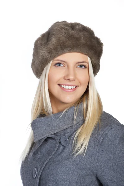 Portrait of a gorgeous winter woman smiling - over white background — Stock Photo, Image