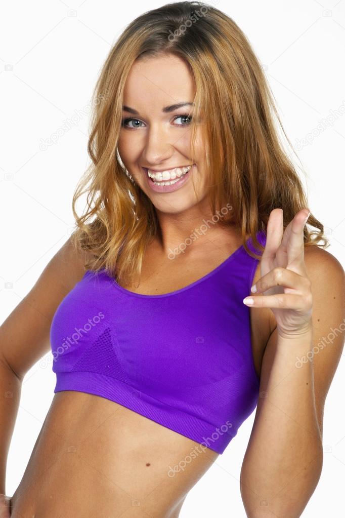 Beautiful young fitness woman. Isolated over white background