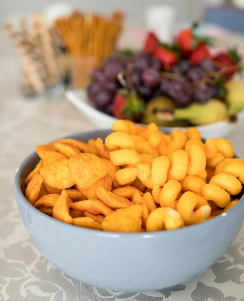 different types of chips in a bowl at a home party