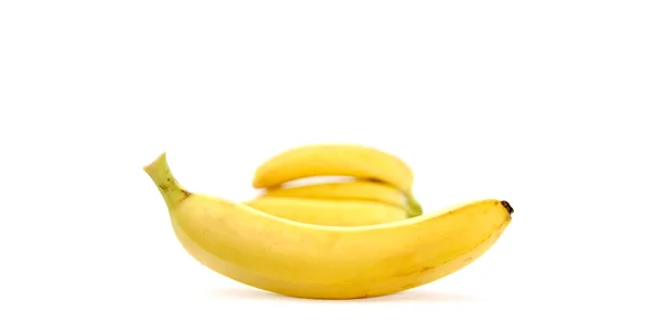 Bananer på hvit bakgrunn – stockfoto