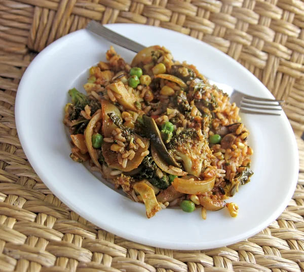 Vegan vegetable rice dish with fork — Stock Photo, Image