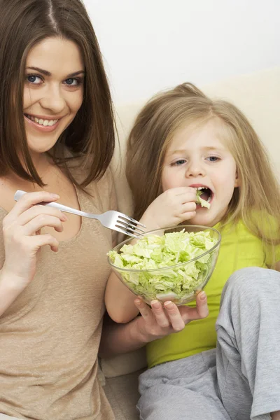Mother feeds little girl — Stock Photo, Image