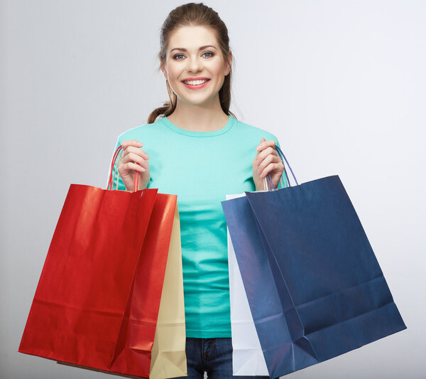 Happy woman hold shopping bag. Studio isolated portrait