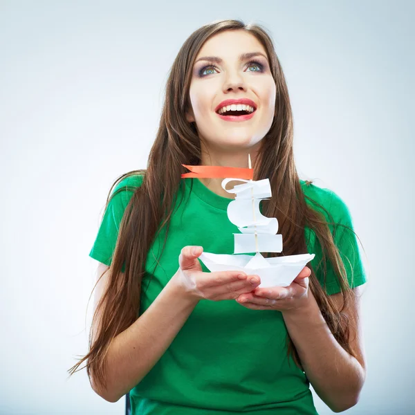 Young smiling woman hold white paper ship — Stock Photo, Image