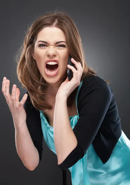 Angry woman shouts in phone Royalty Free Stock Photos