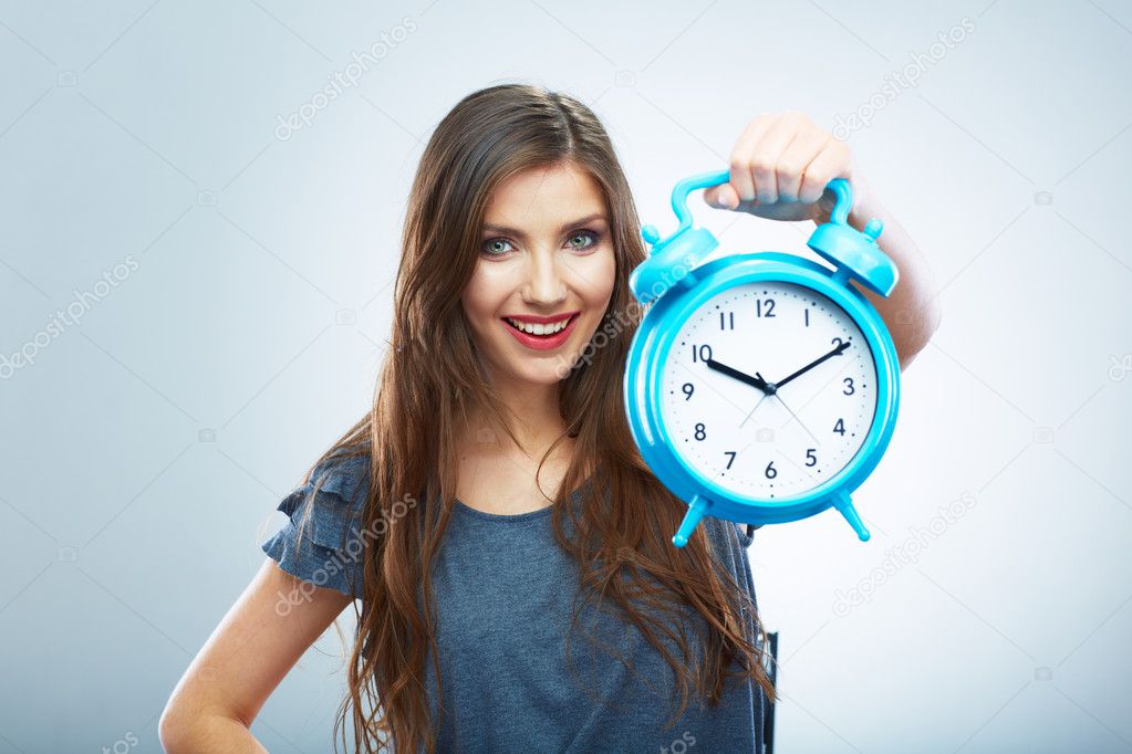 Young smiling woman hold watch.