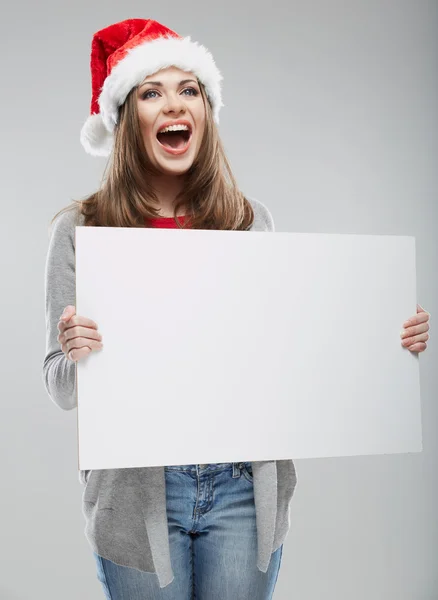 Donna in cappello da Babbo Natale con tavola bianca — Foto Stock