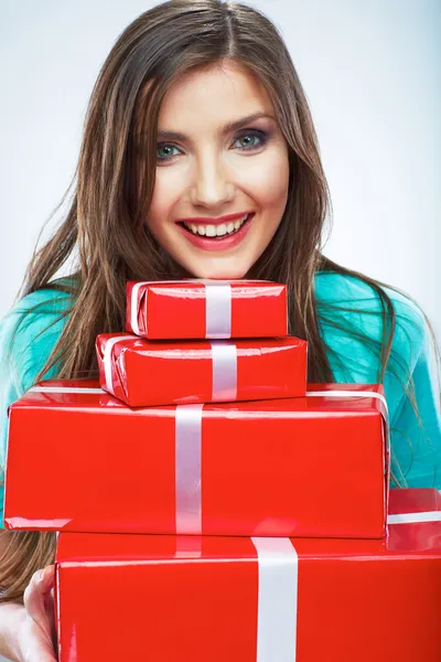 Portrait of young happy smiling woman hold red gift box. Isolat