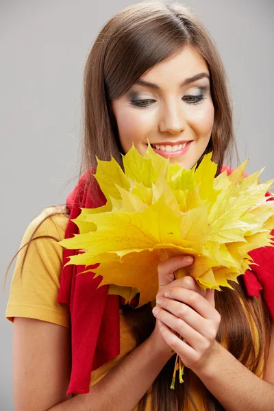 Woman with autumn foliage — Stock Photo, Image