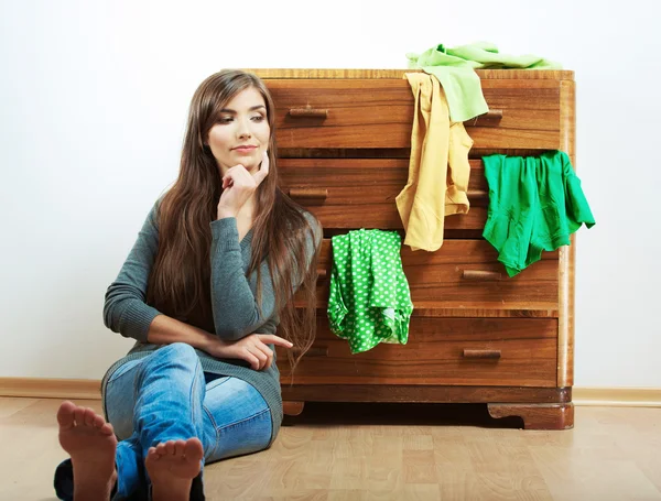 Young woman with clothes at home — Stock Photo, Image