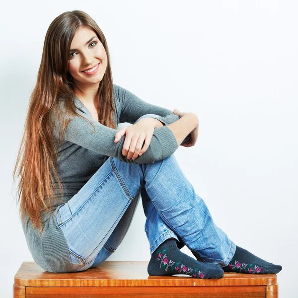 Young woman with clothes at home — Stock Photo, Image