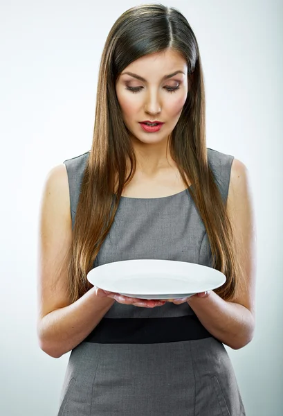 Portrait of business woman hold empty white plate. — Stock Photo, Image