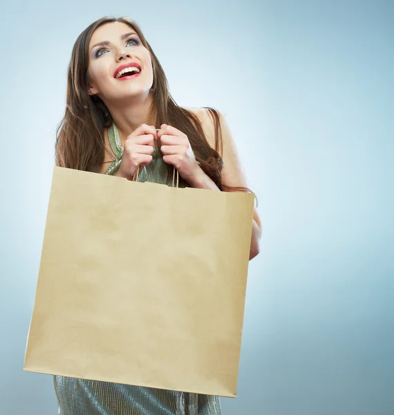Happy woman holds shopping bag — Stock Photo, Image