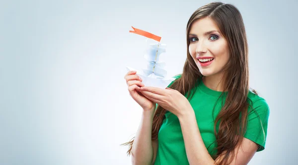 Woman holding white paper ship — Stock Photo, Image