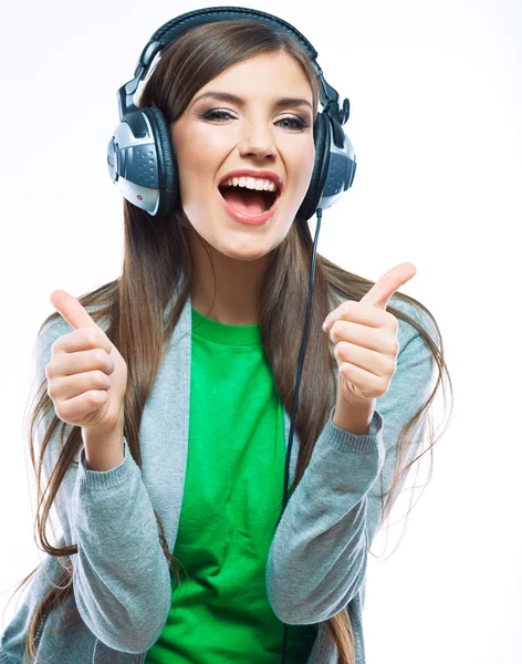 Young woman with headphones with thumb up — Stock Photo, Image