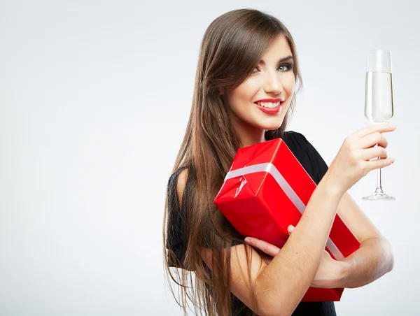 Woman holding gift box and glass of champagne Royalty Free Stock Images