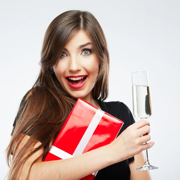 Woman holding gift box and glass of champagne Stock Picture