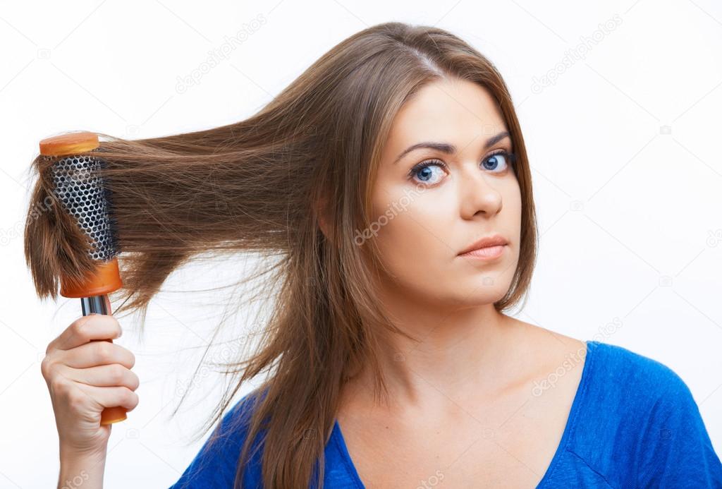 Woman combing long hair