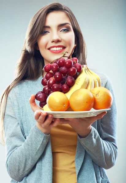 Frau mit tropischen Früchten — Stockfoto