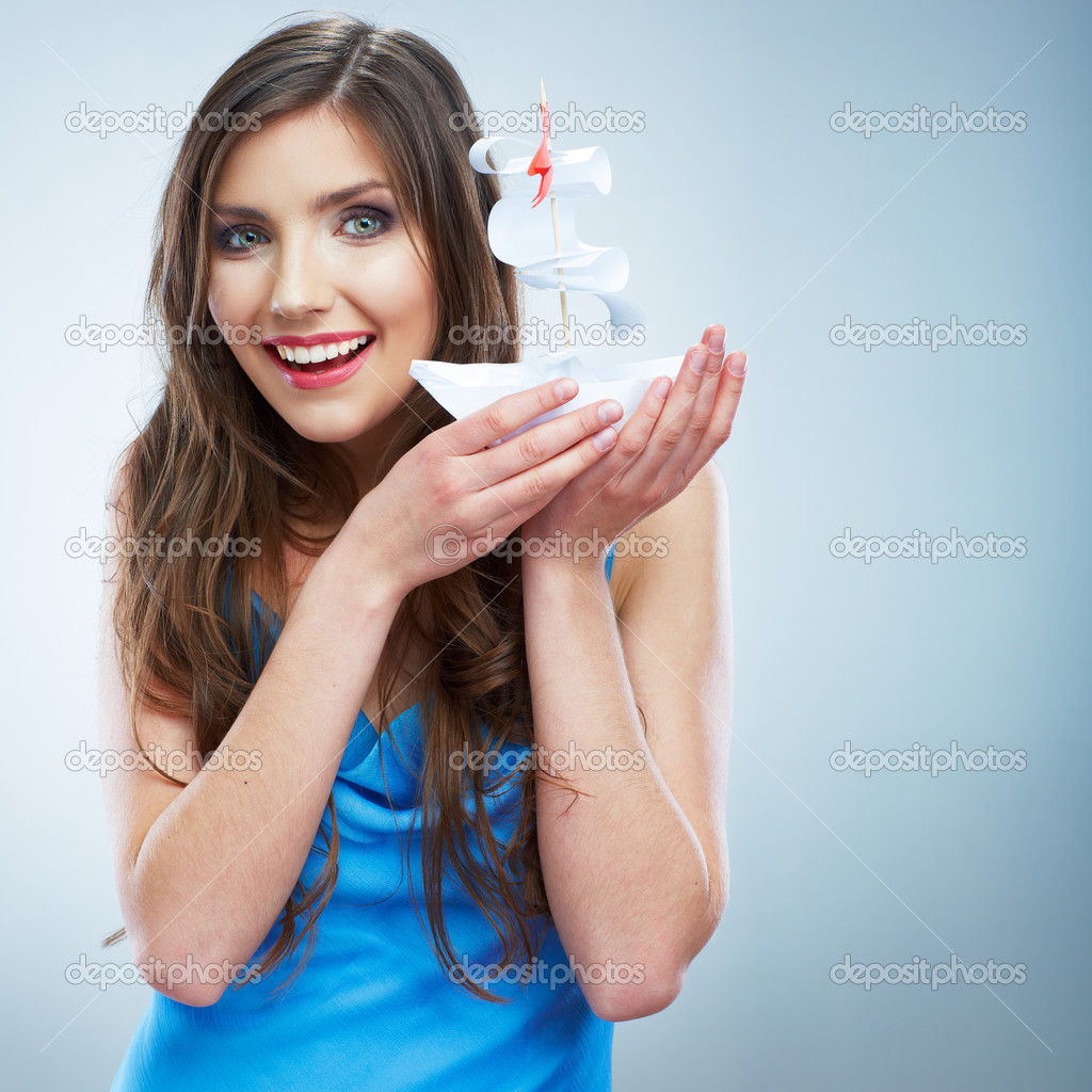Woman hold paper ship