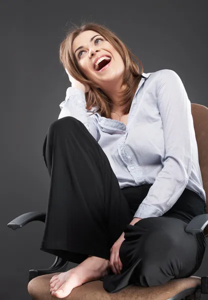 Woman sits in office chair — Stock Photo, Image