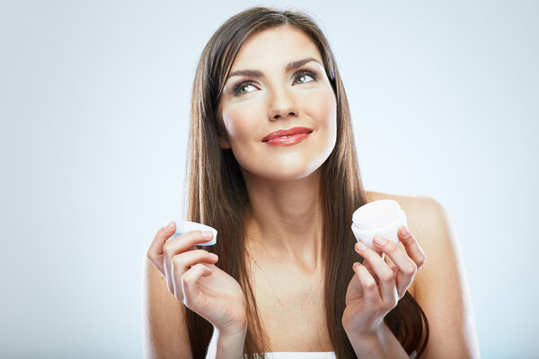 Woman hold cosmetic cream