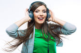 Woman with headphones listening music .