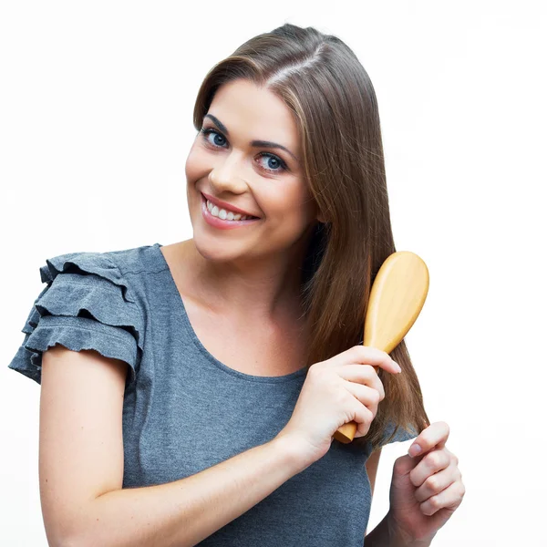 Mujer peinando cabello — Foto de Stock