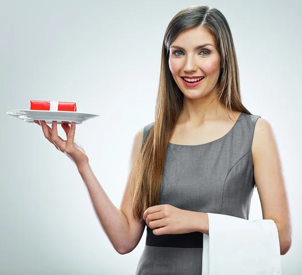 Young business woman with gift on a plate. — Stock Photo, Image