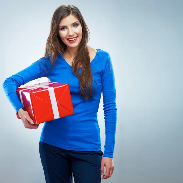 Smiling woman holding red gift box — Stock Photo, Image