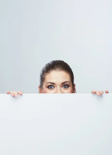 Business woman face looking out white banner. Stock Photo