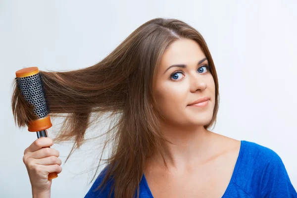 Woman comb long hair — Stock Photo, Image