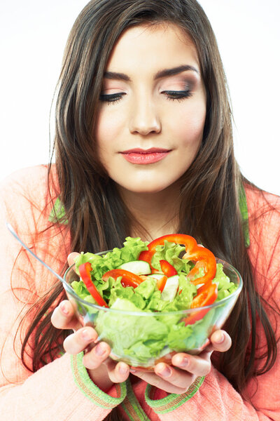 Young woman eat salad.