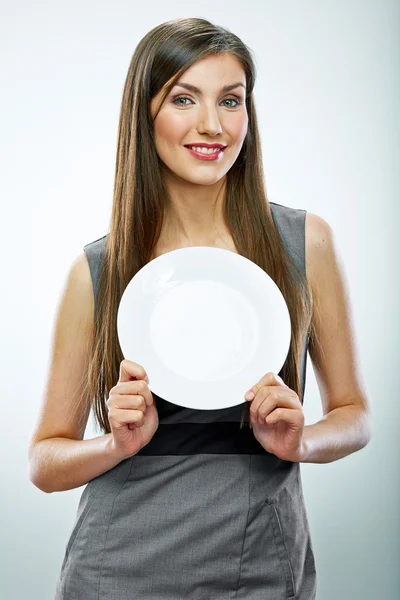 Geschäftsfrau hält leeren Teller — Stockfoto