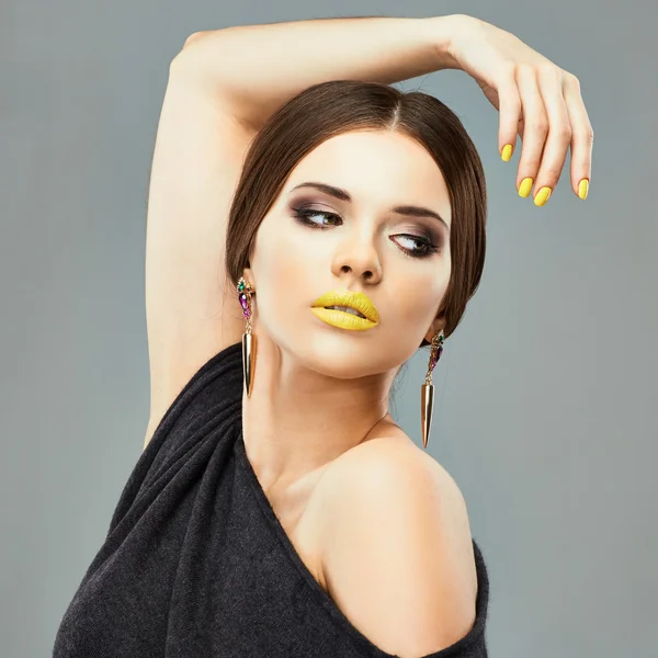 Woman with yellow lips and nail — Stock Photo, Image