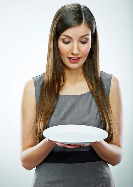 Woman hold empty white plate. — Stock Photo, Image