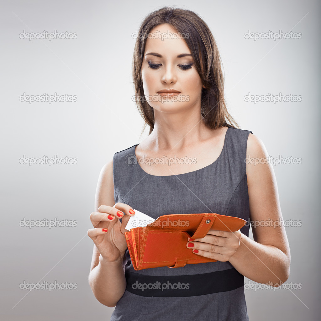 Woman holds card and purse
