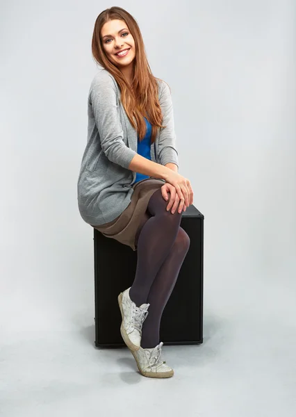 Young woman seating on guitar amplifier. — Stock Photo, Image