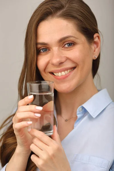 Woman face with water glass close up isolated portrait.