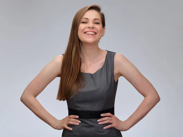 Laughing woman in business dress standing with hands on hip. isolated female portrait. Girl with long hair.