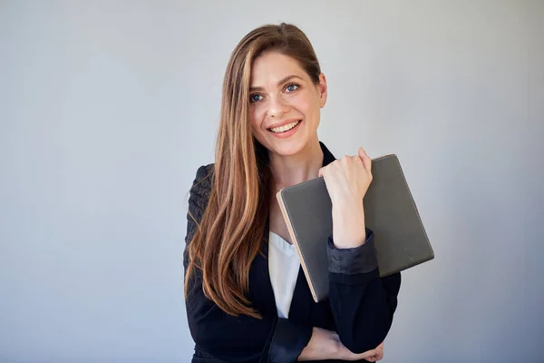 Woman teacher or girl student in black suit holding book.